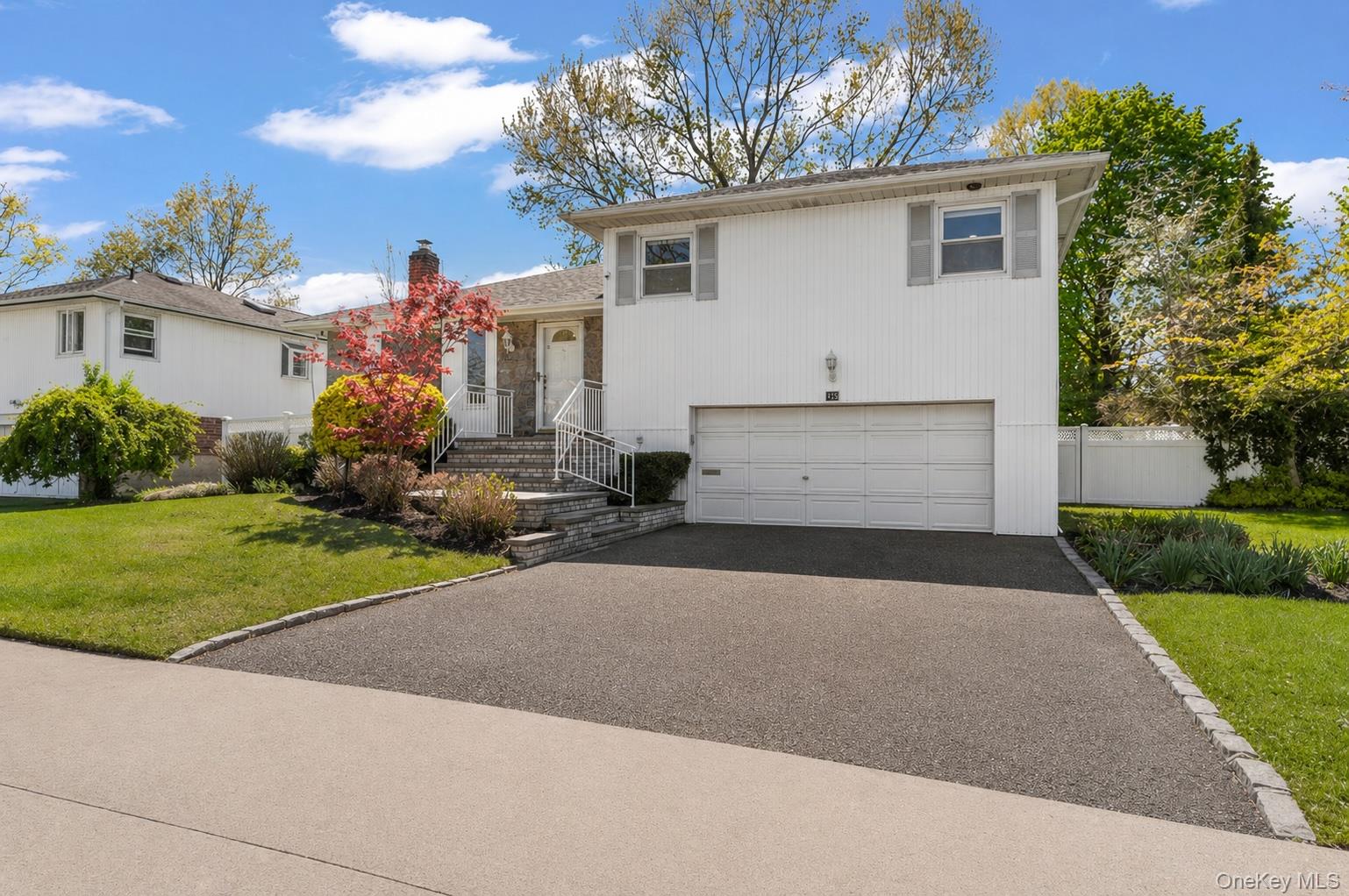 61 Winthrop Road Plainview, NY 11803 - Photo 1 of 37 a house view with a garden space