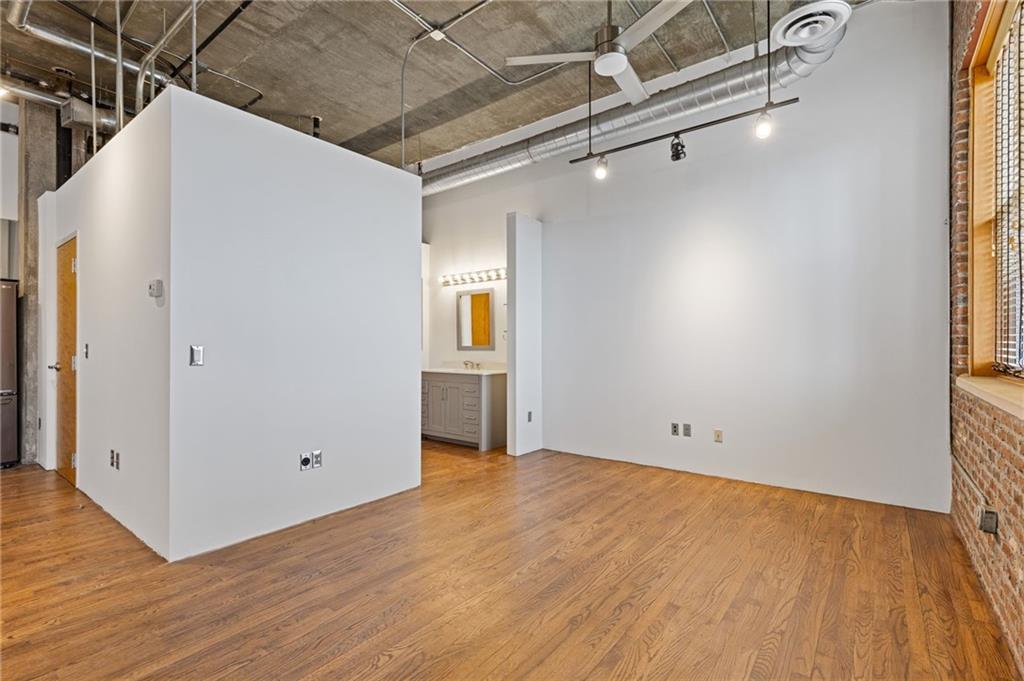 3235 Roswell Road, Unit 818 Atlanta, GA 30305 - Photo 5 of 24 a view of a room with wooden floor