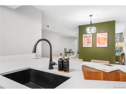 a kitchen with a sink and a stove top oven