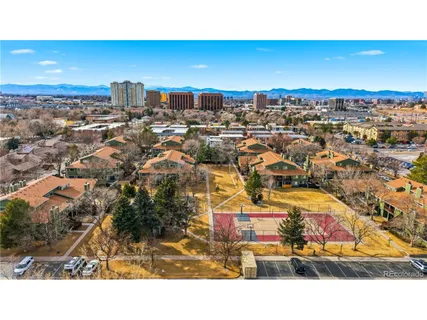 a view of a house with wooden fence
