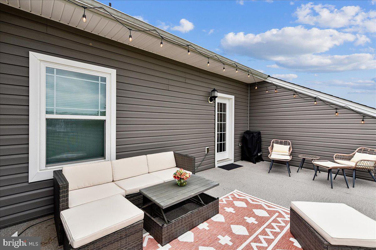 2209 Woodlands Road Windsor Mill, MD 21244 - Photo 39 of 75 ROOFTOP DECK WITH PLENTY OF SEATING OPTIONS