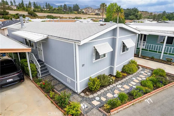 a aerial view of a house with a yard