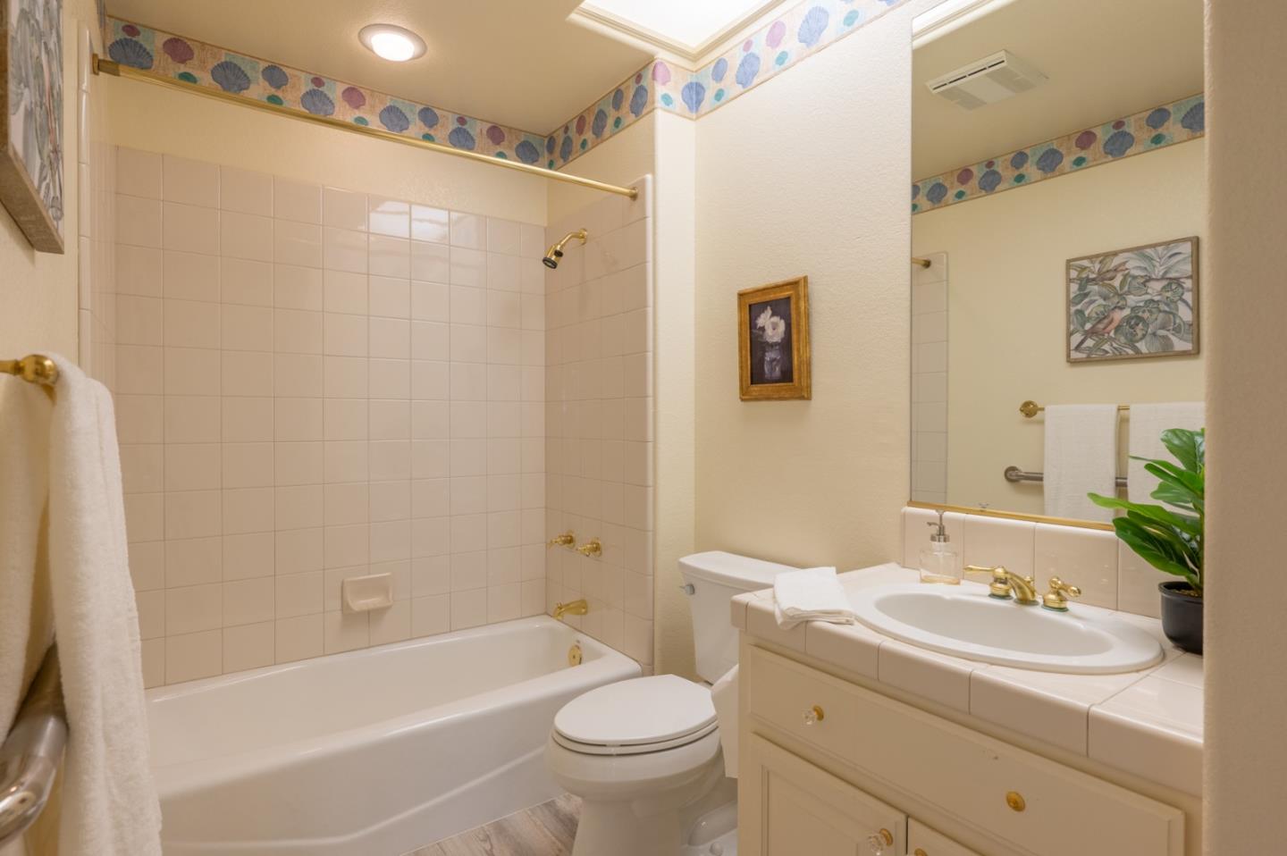 14440 Mountain Quail Road Salinas, CA 93908 - Photo 17 of 30 a bathroom with a sink a toilet and shower
