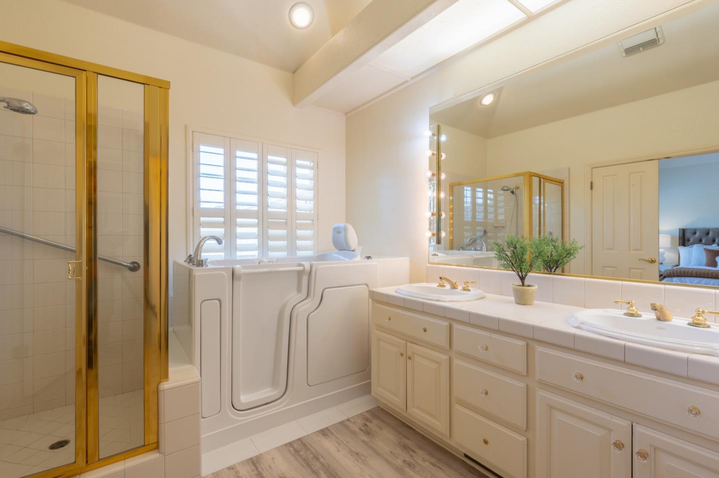 14440 Mountain Quail Road Salinas, CA 93908 - Photo 20 of 30 a spacious bathroom with a double vanity sink a mirror and a shower