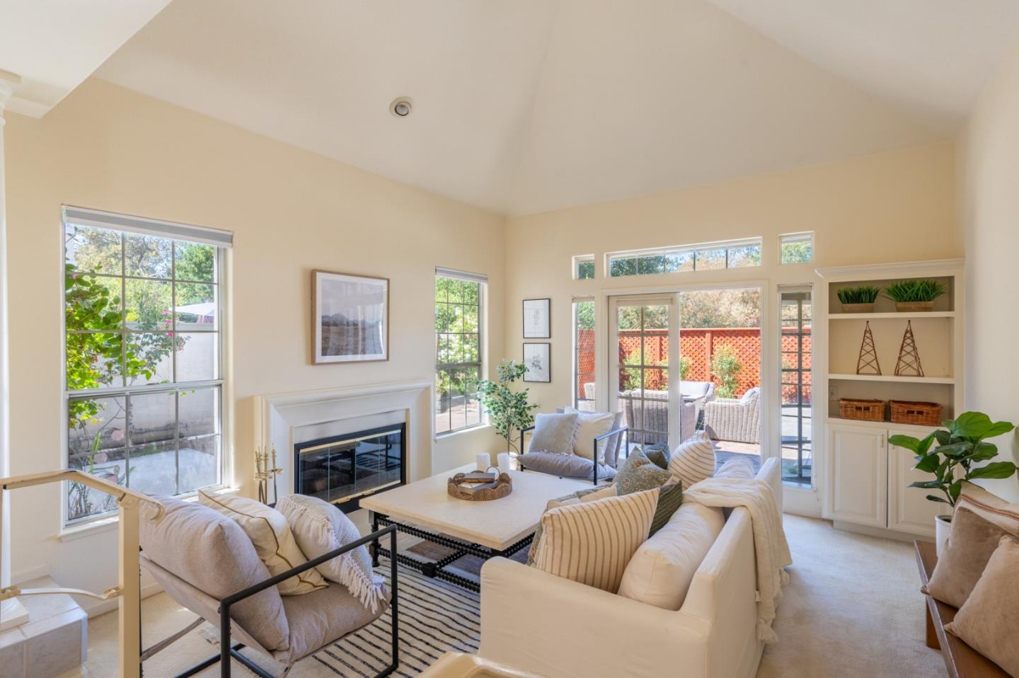 14440 Mountain Quail Road Salinas, CA 93908 - Photo 2 of 30 a living room with furniture a large window and a fireplace
