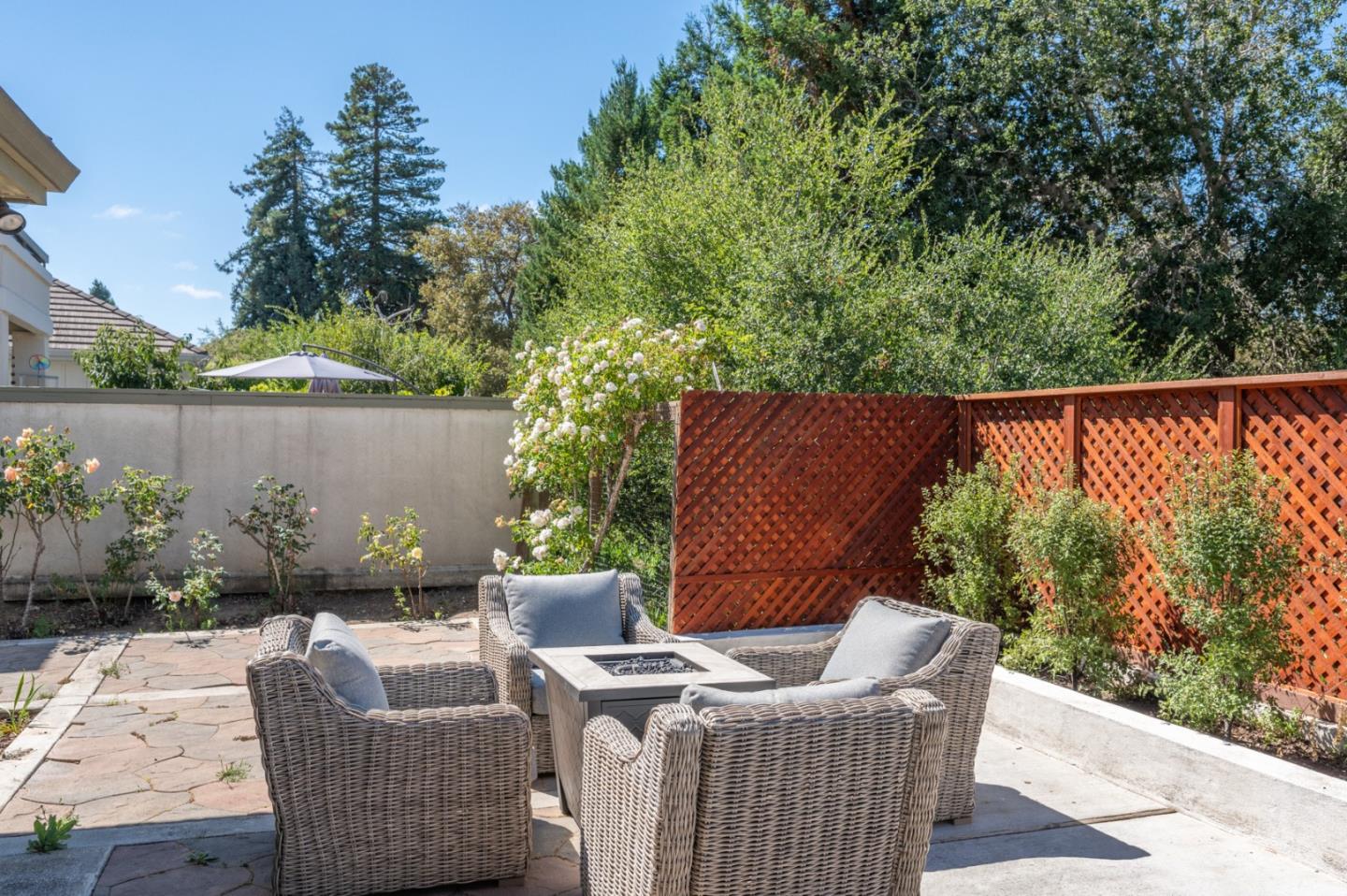 14440 Mountain Quail Road Salinas, CA 93908 - Photo 22 of 30 a view of backyard with seating space and trees in the background