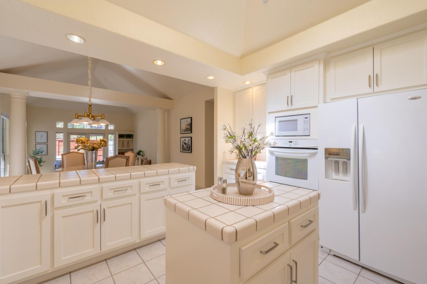 14440 Mountain Quail Road Salinas, CA 93908 - Photo 5 of 30 a kitchen with white cabinets and stainless steel appliances
