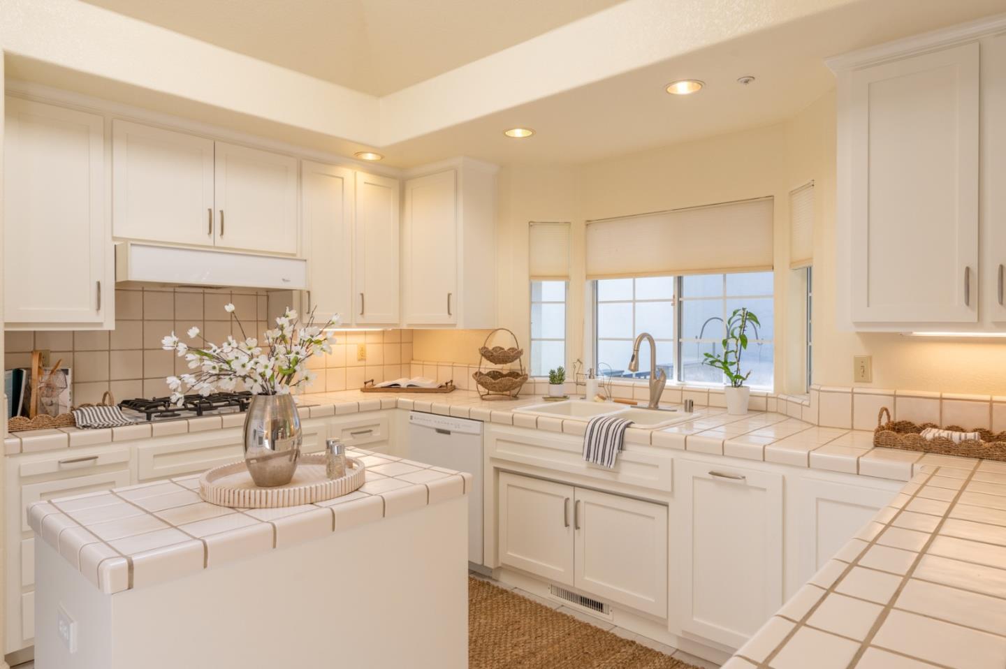 14440 Mountain Quail Road Salinas, CA 93908 - Photo 7 of 30 a kitchen with sink a stove and cabinets
