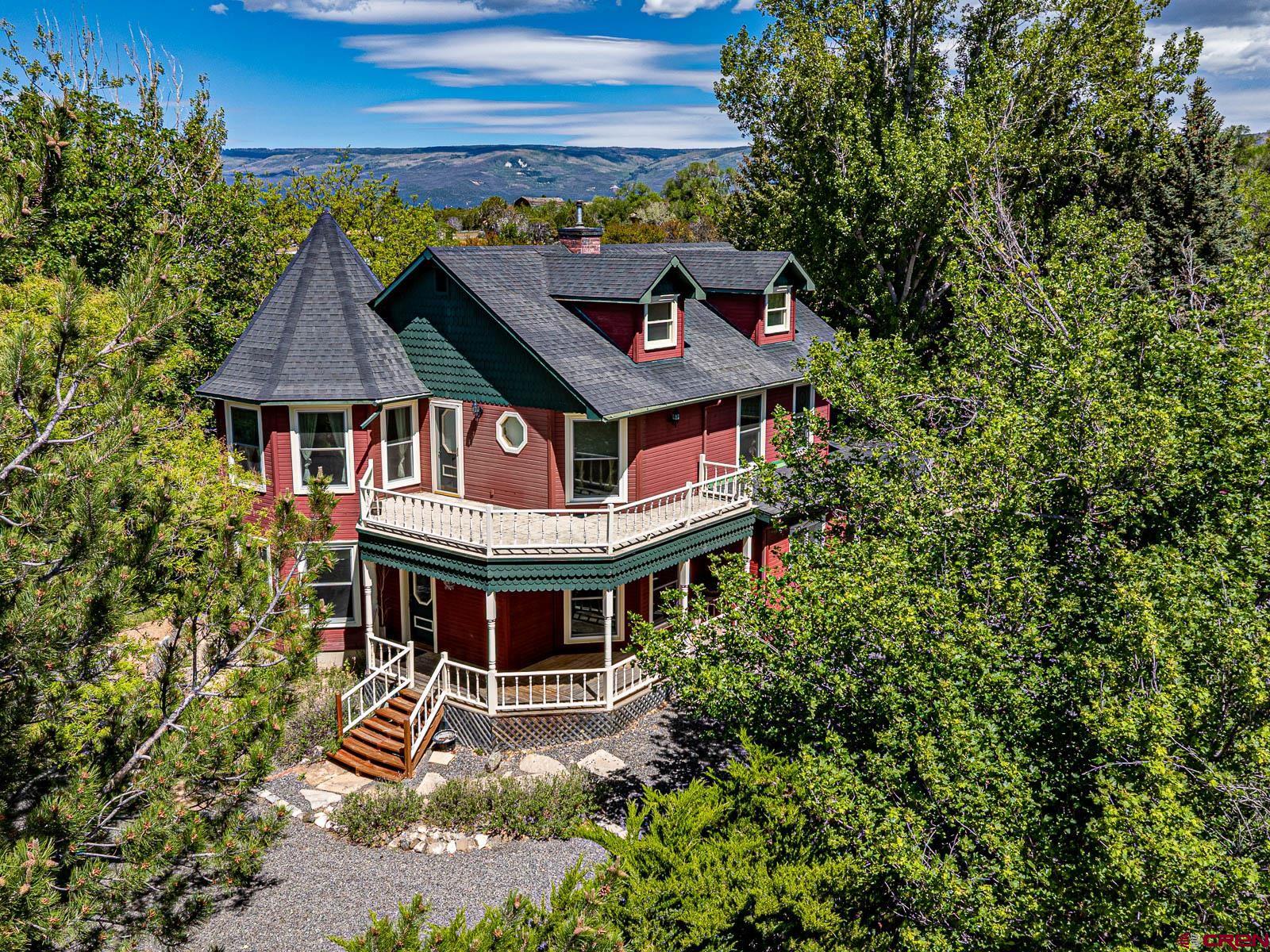 16331 2550th Road Cedaredge, CO 81413 - Photo 1 of 45 an aerial view of a house with a yard