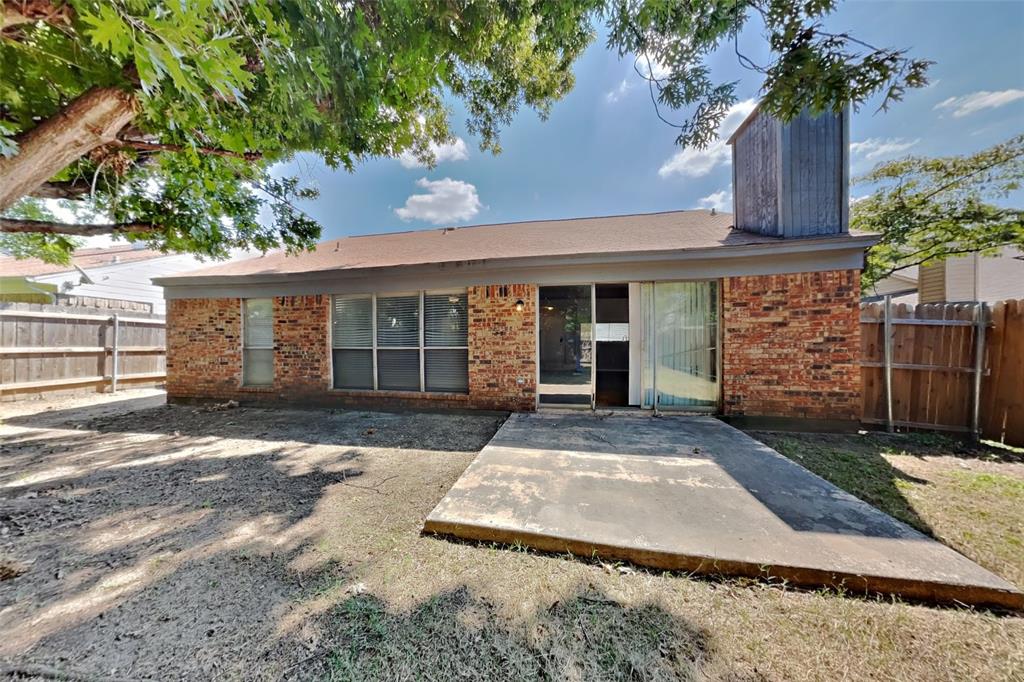 4605 Greenfern Lane Fort Worth, TX 76137 - Photo 16 of 18 a front view of a house with garden