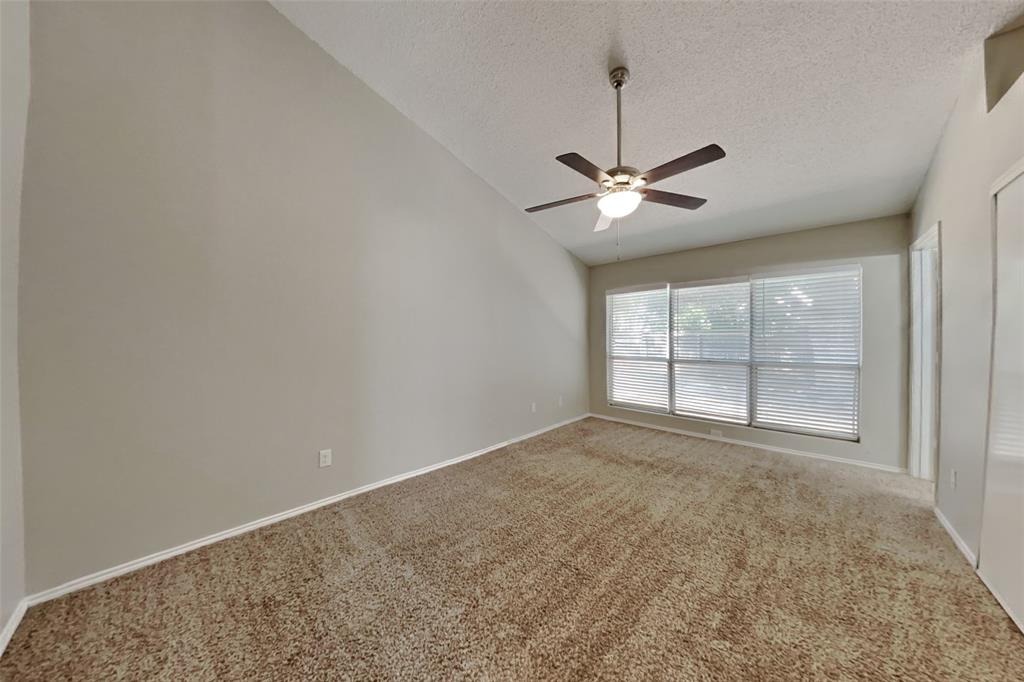 4605 Greenfern Lane Fort Worth, TX 76137 - Photo 7 of 18 an empty room with fan and windows