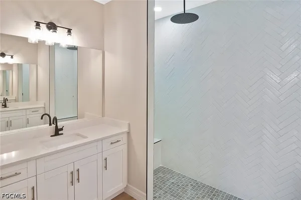 a bathroom with a sink and a mirror