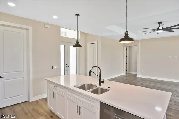 a kitchen with a sink and cabinets