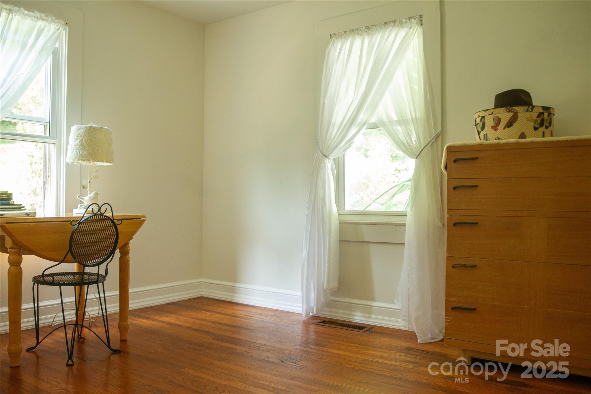 607 Fred Sparks Road Bakersville, NC 28705 - Photo 11 of 41 a room with wooden floor and windows