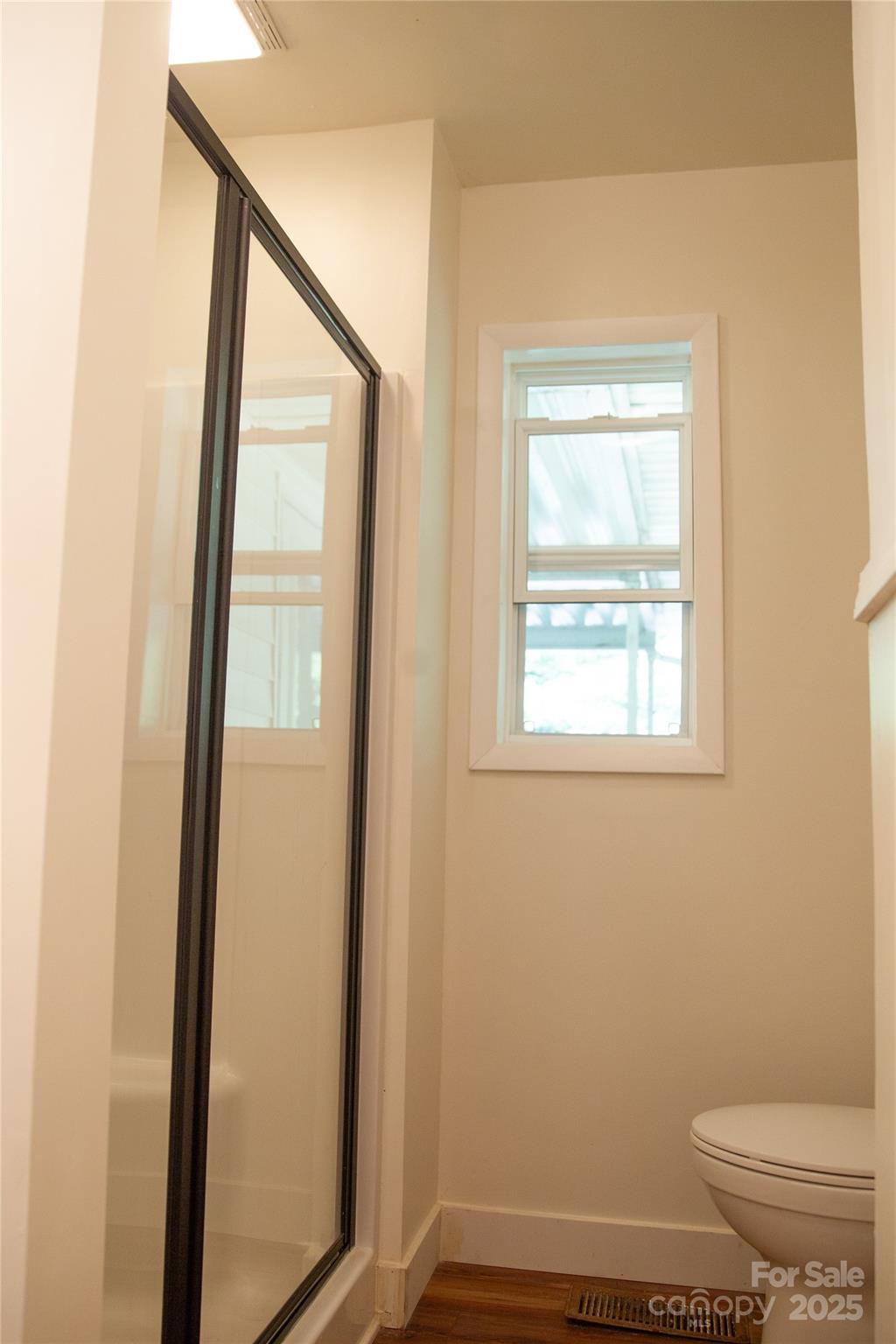 607 Fred Sparks Road Bakersville, NC 28705 - Photo 18 of 41 a bathroom with a toilet a sink and a mirror