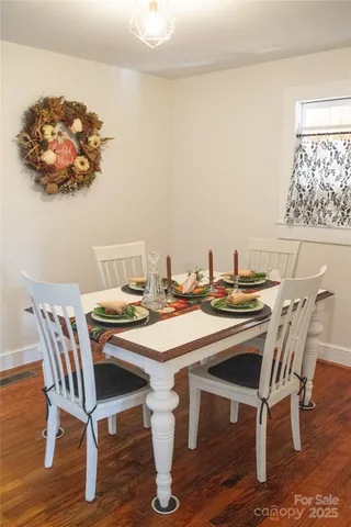 a view of a house with a yard and garden