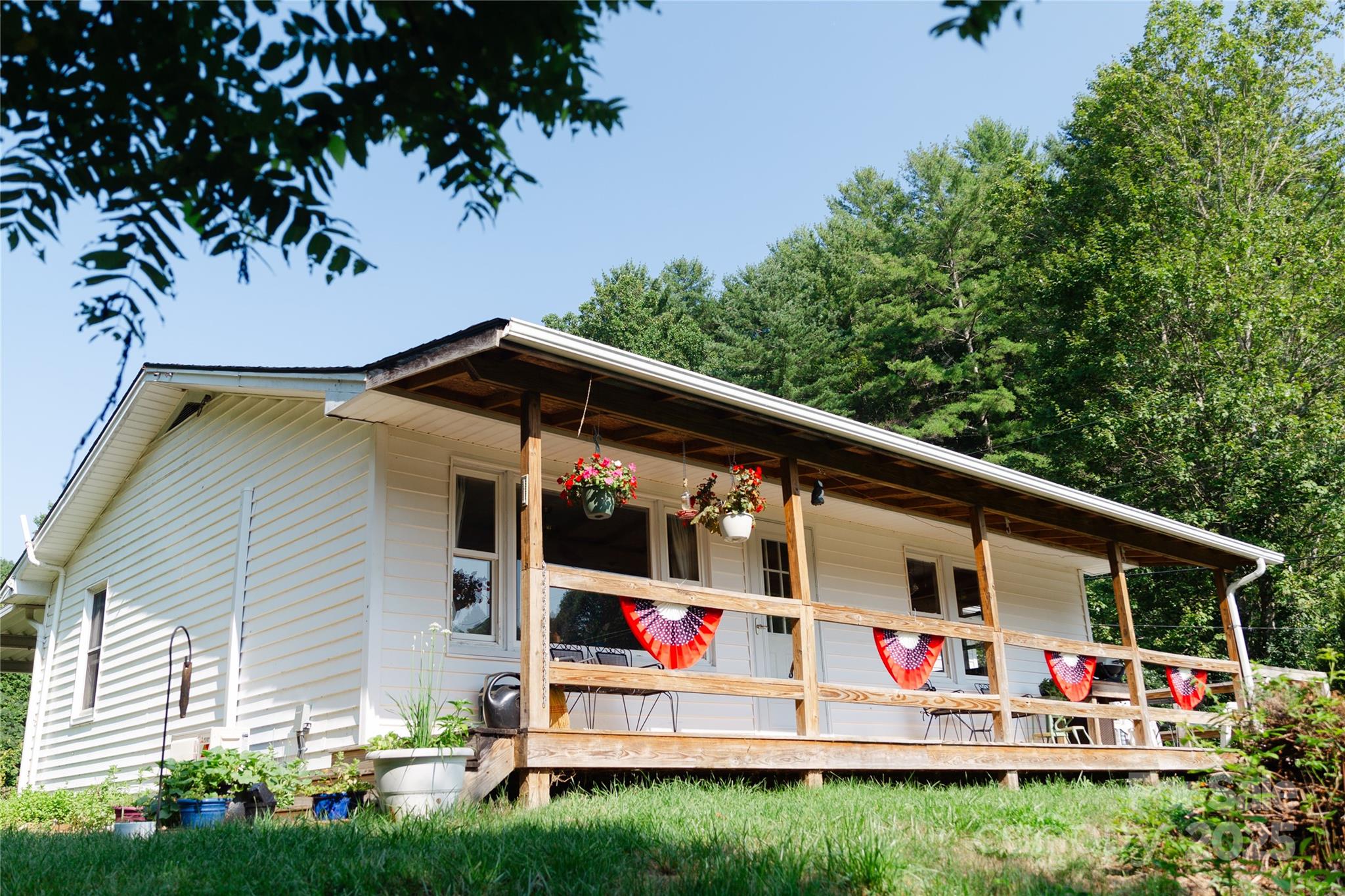 607 Fred Sparks Road Bakersville, NC 28705 - Photo 29 of 41 a front view of a house with garden
