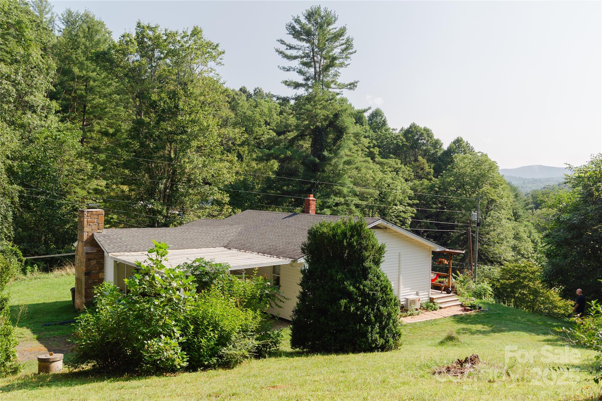 607 Fred Sparks Road Bakersville, NC 28705 - Photo 31 of 41 a view of a house with a yard and garden