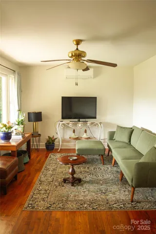 a living room with furniture and a flat screen tv