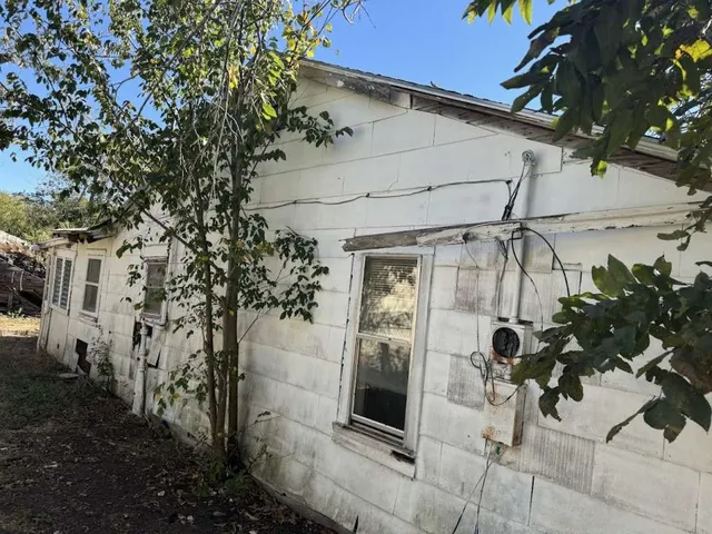 a view of a house with a potted plant