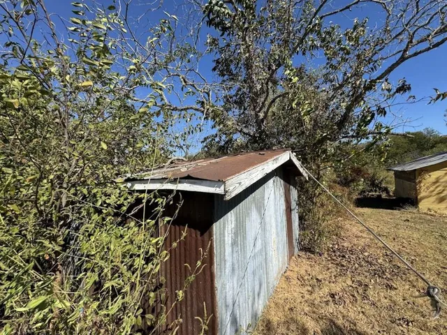 a house with trees in front of it