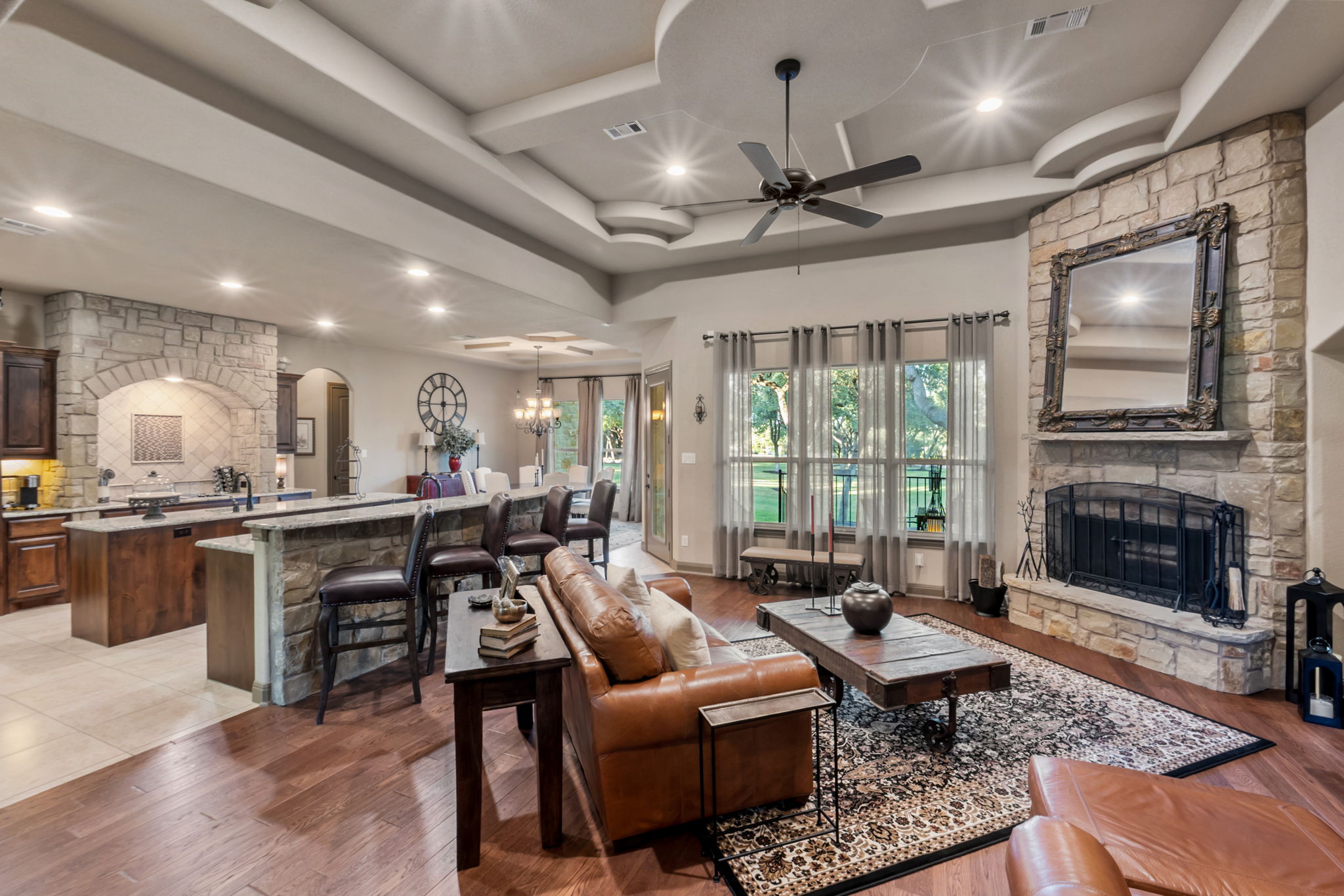 104 Vista Lane Georgetown, TX 78633 - Photo 4 of 36 Hand scraped wood flooring with enhanced ceiling and stone work are sure to delight.