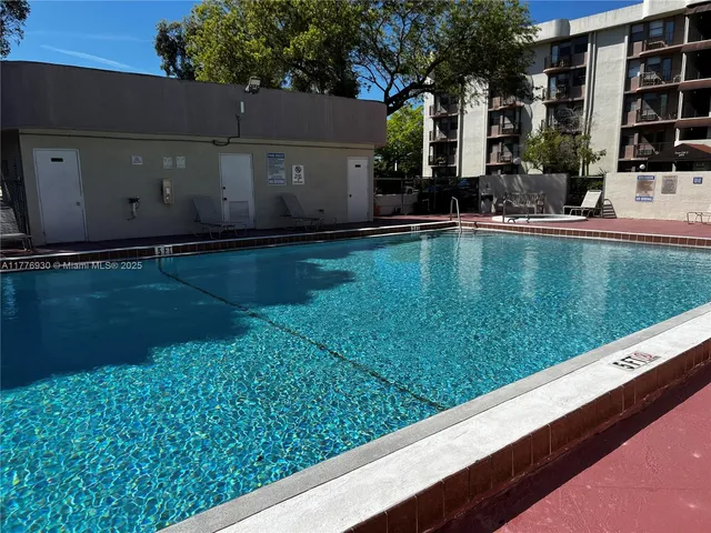 a view of swimming pool from a balcony