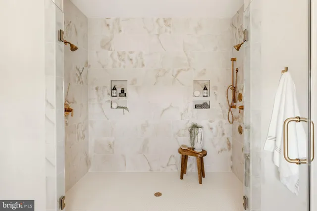 a bathroom with a sink mirror and