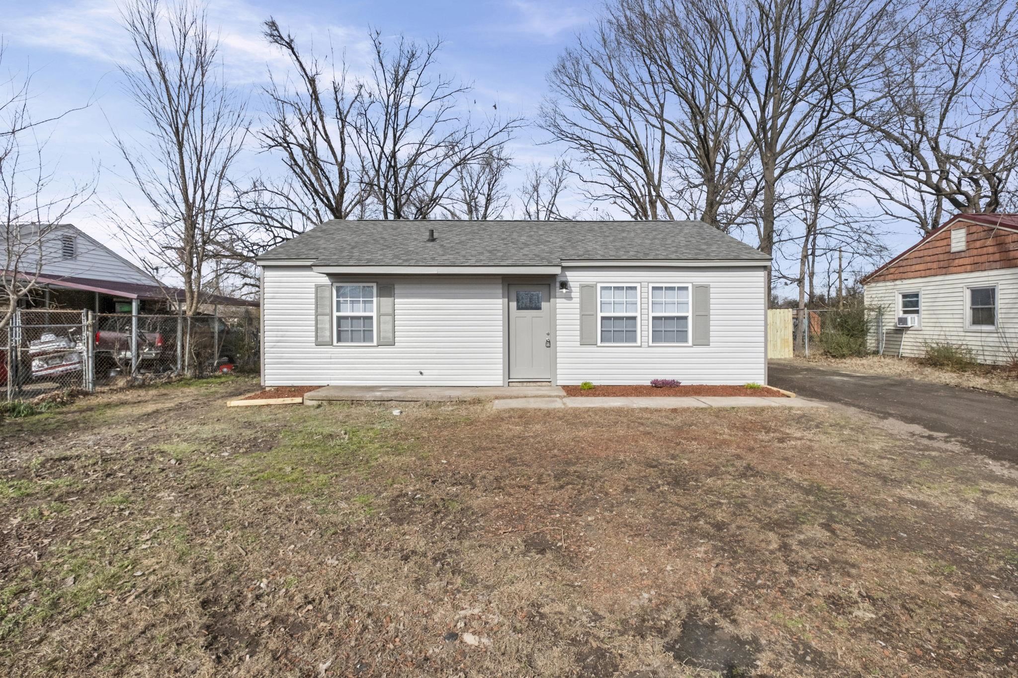 View of front of home with a shingled roof