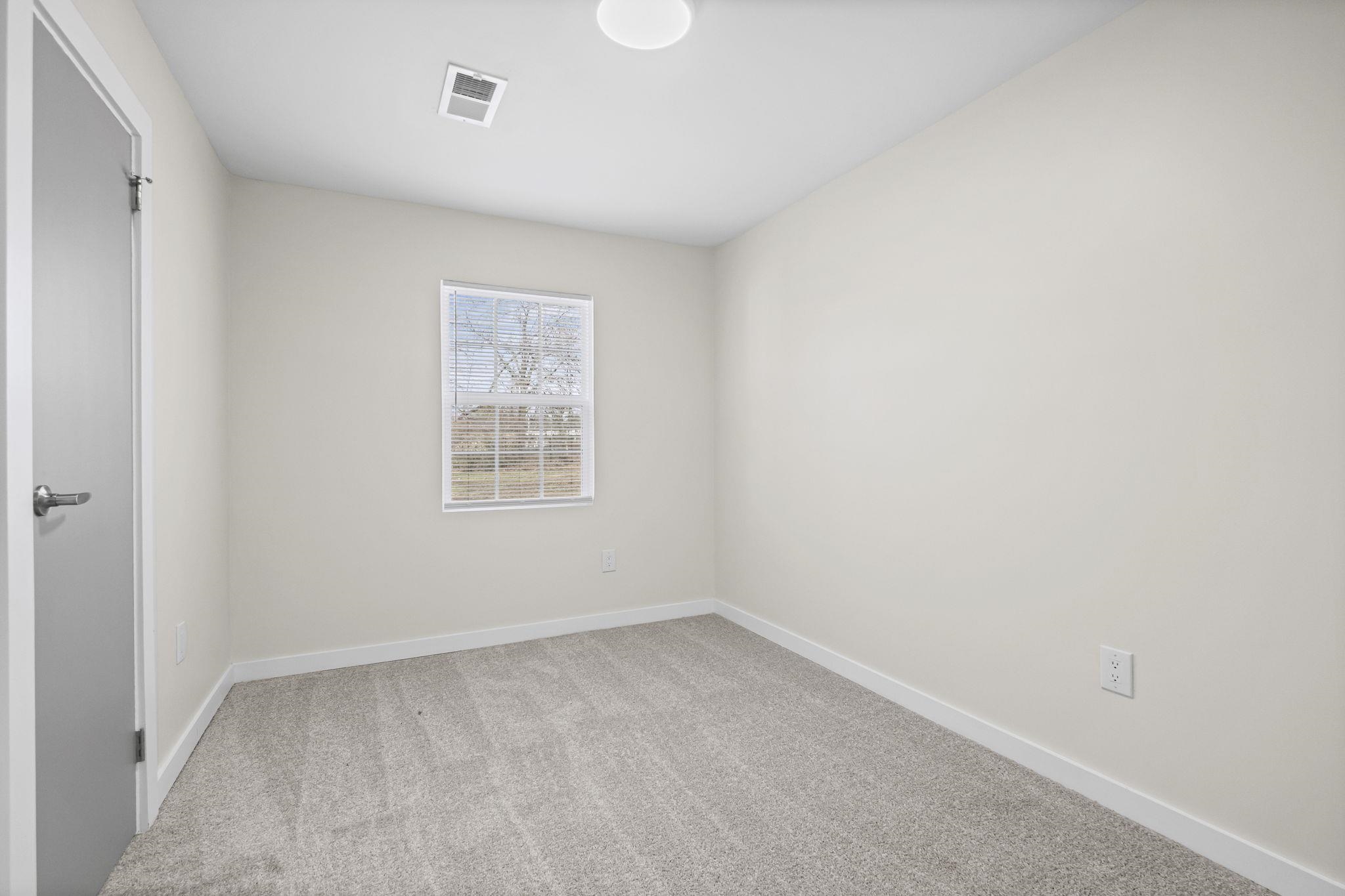 4774 Montgomery Road Millington, TN 38053 - Photo 15 of 20 Carpeted spare room featuring baseboards