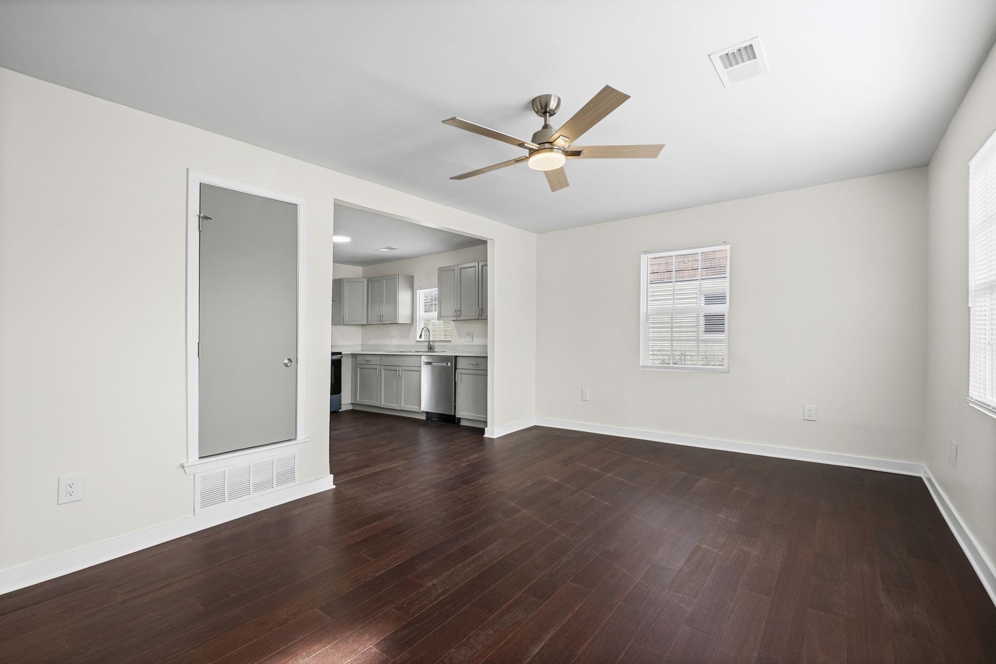 4774 Montgomery Road Millington, TN 38053 - Photo 3 of 20 Unfurnished living room featuring ceiling fan and dark wood-style floors