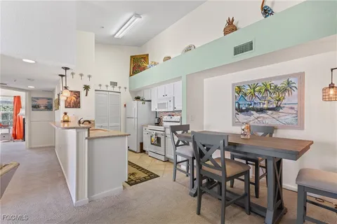 a view of a dining room that has a table and chair in it
