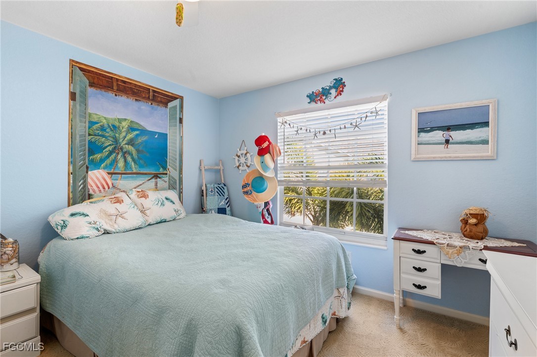 4149 Residence Drive, Unit 824 Fort Myers, FL 33901 - Photo 20 of 25 a bedroom with a bed and a window