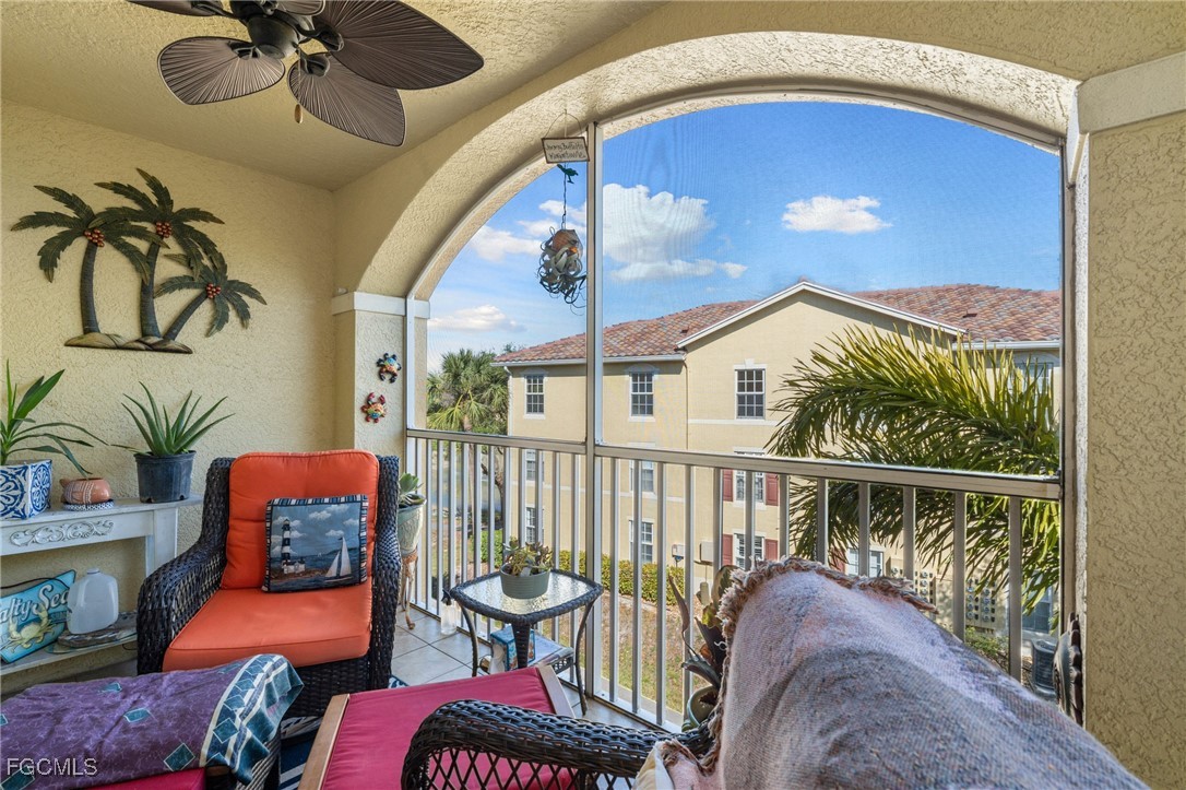 4149 Residence Drive, Unit 824 Fort Myers, FL 33901 - Photo 22 of 25 a balcony with furniture and a potted plant