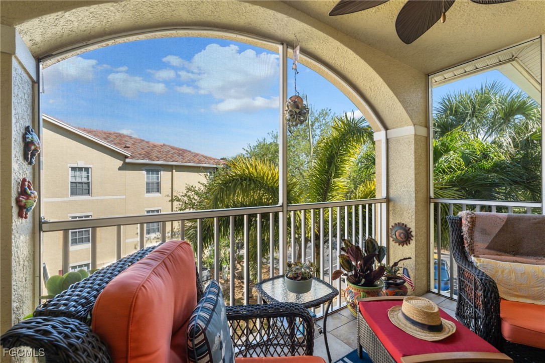 4149 Residence Drive, Unit 824 Fort Myers, FL 33901 - Photo 23 of 25 a view of balcony with furniture and garden