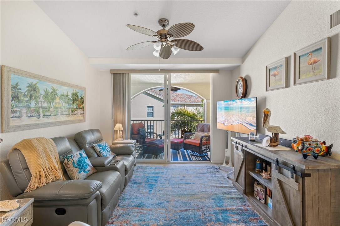 4149 Residence Drive, Unit 824 Fort Myers, FL 33901 - Photo 5 of 25 a living room with furniture and a window