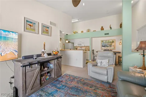 a kitchen with a refrigerator and a sink