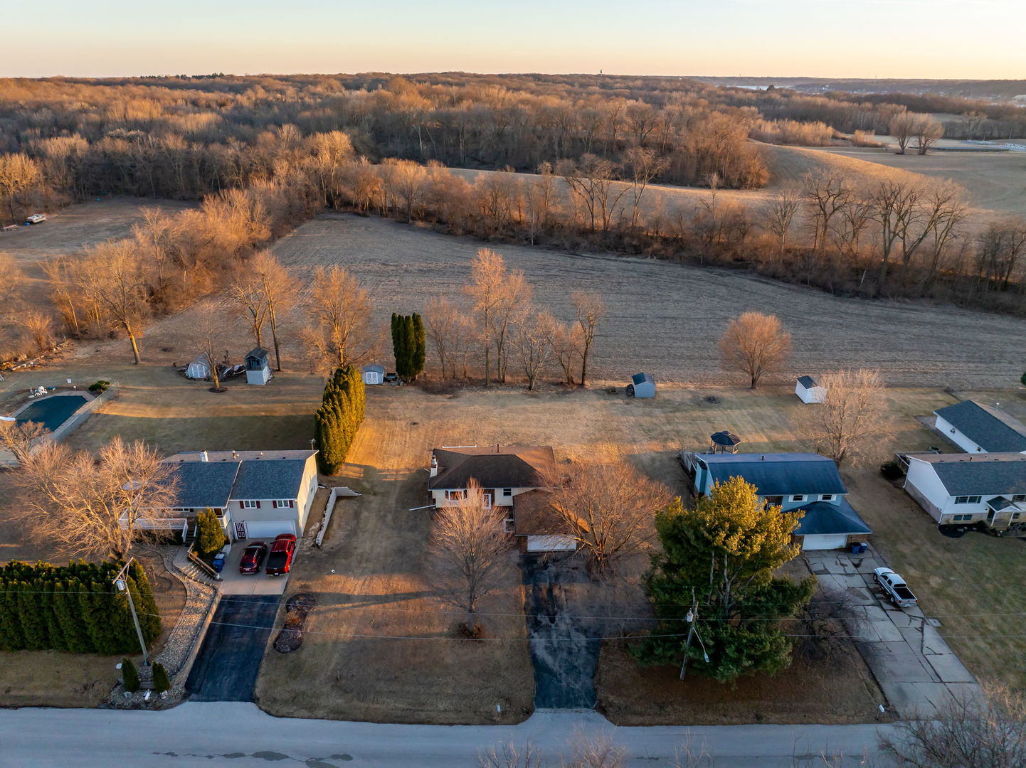 712 Fairfield Road Port Byron, IL 61275 - Photo 1 of 45 an aerial view of a house with a yard fire pit and outdoor seating