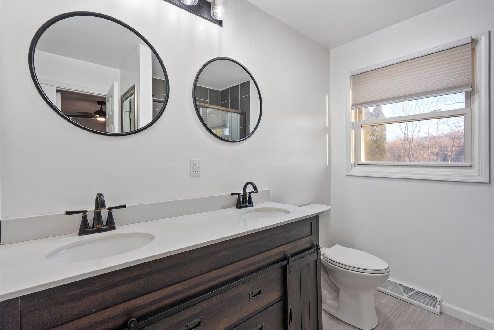 712 Fairfield Road Port Byron, IL 61275 - Photo 13 of 45 a bathroom with a toilet a sink and a mirror
