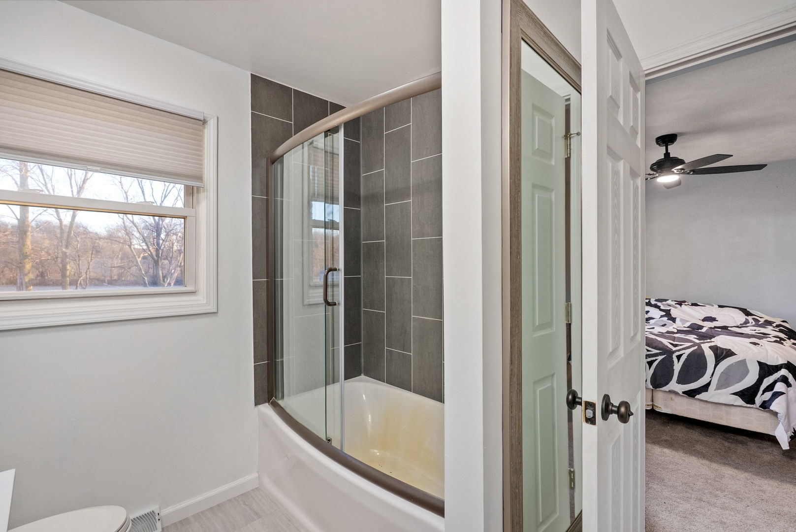 712 Fairfield Road Port Byron, IL 61275 - Photo 14 of 45 a bathroom with a bathtub and a shower