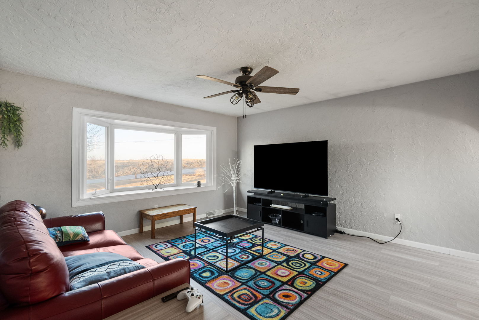 712 Fairfield Road Port Byron, IL 61275 - Photo 6 of 45 a living room with furniture and a flat screen tv