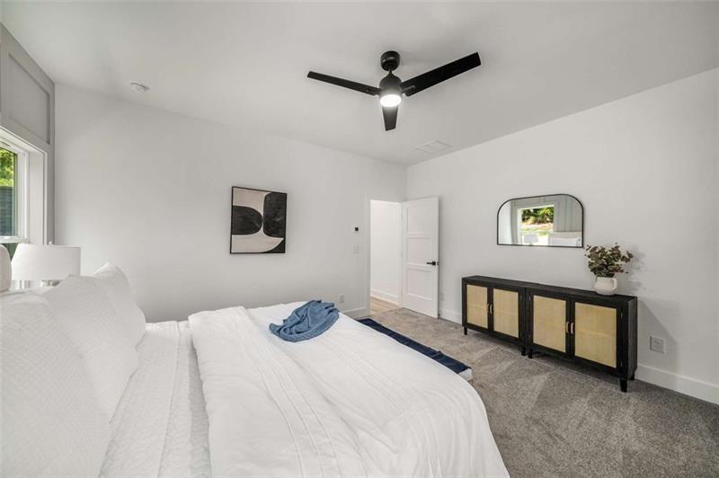 7262 Creekside Way Jefferson, GA 30549 - Photo 29 of 52 a bedroom with a bed and a night stand