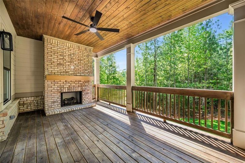 7262 Creekside Way Jefferson, GA 30549 - Photo 38 of 52 a view of balcony with a floor to ceiling window with wooden floor