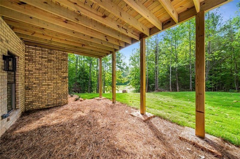 7262 Creekside Way Jefferson, GA 30549 - Photo 41 of 52 a view of a yard with porch and garden