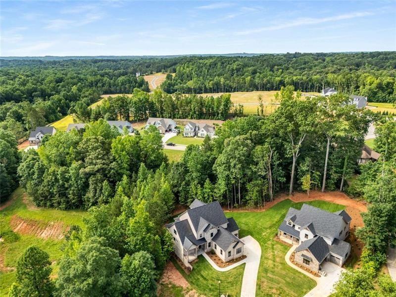 7262 Creekside Way Jefferson, GA 30549 - Photo 50 of 52 an aerial view of a house with garden space and outdoor seating