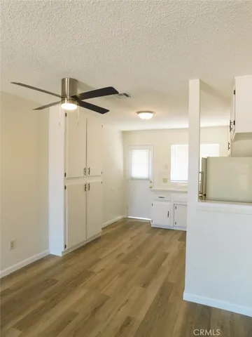 a view of a kitchen with a dishwasher and a window