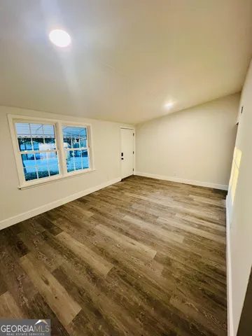 a view of an empty room and window