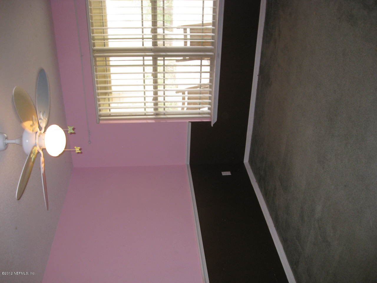 7023 Elfo Road Keystone Heights, FL 32656 - Photo 11 of 12 a bathroom with a window