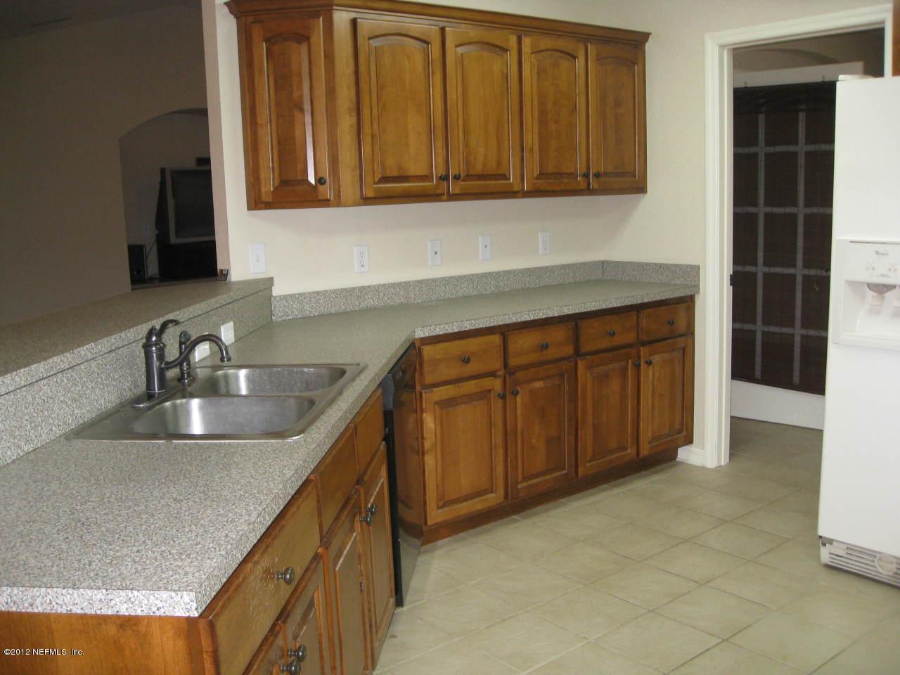 7023 Elfo Road Keystone Heights, FL 32656 - Photo 4 of 12 a kitchen with granite countertop a sink and a stove