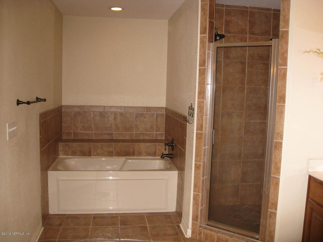 7023 Elfo Road Keystone Heights, FL 32656 - Photo 7 of 12 a bathroom with a shower